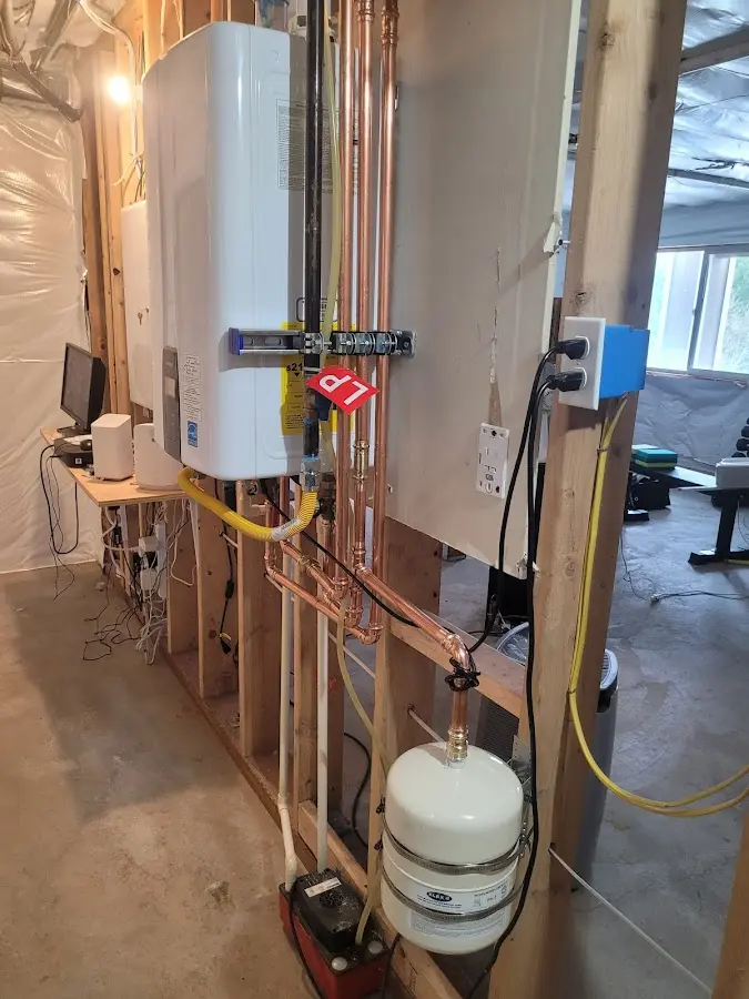 Licensed plumber repairing a kitchen sink in Calverton